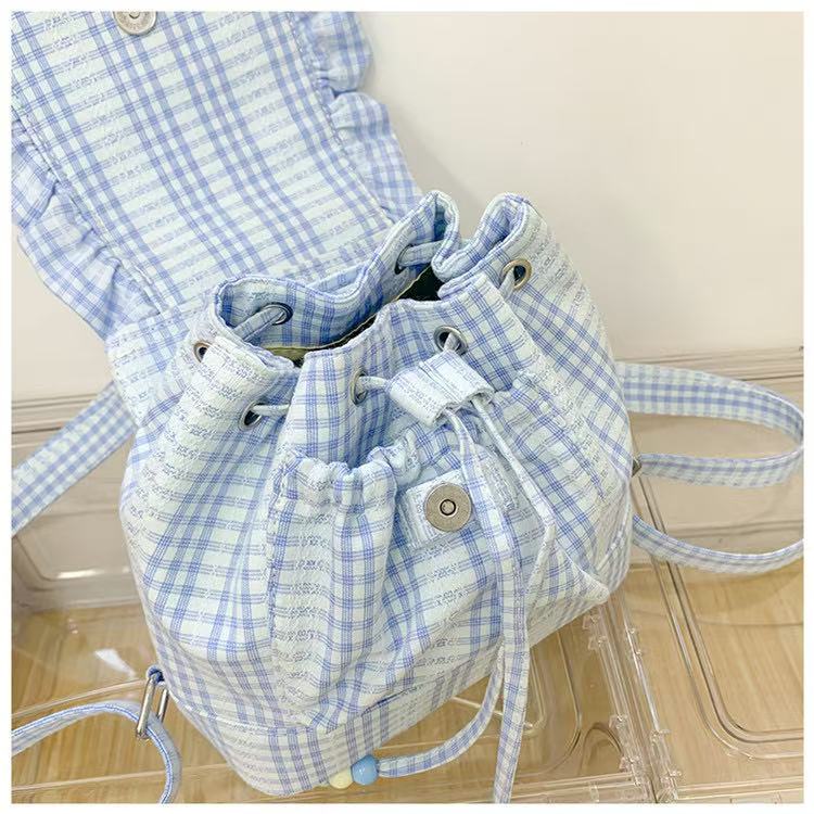 Small backpack with plaid flap