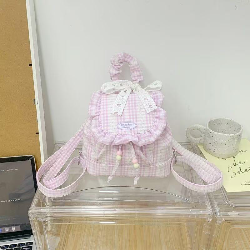 Small backpack with plaid flap