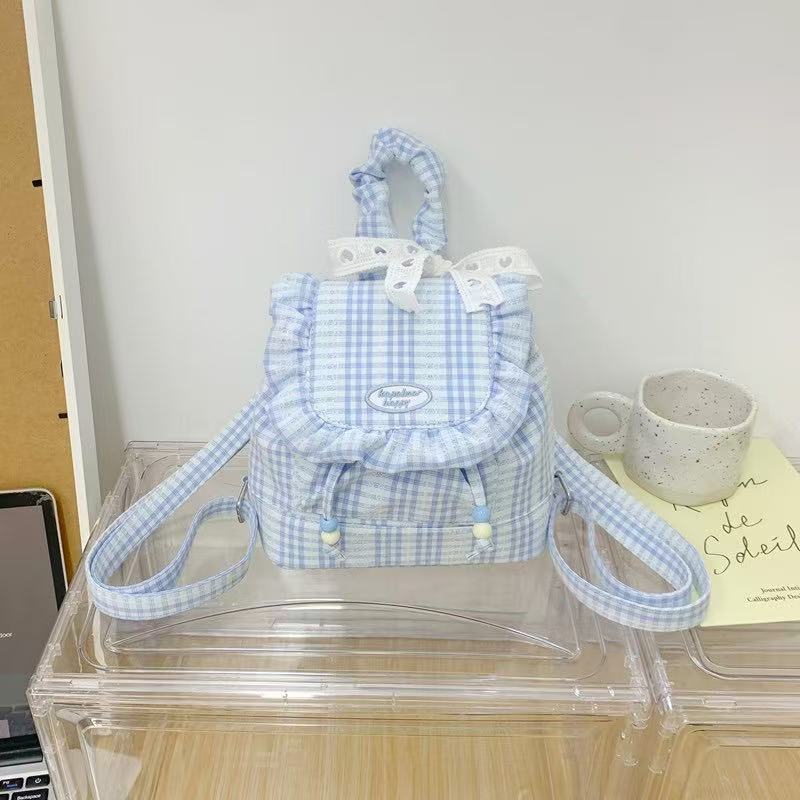 Small backpack with plaid flap