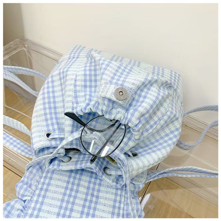 Small backpack with plaid flap